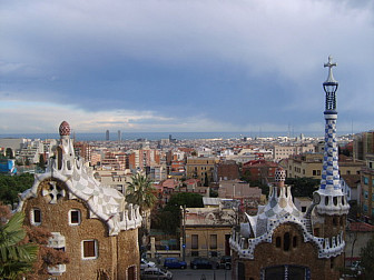 View from Gaudi Park<br>Photo: <a href="https://commons.wikimedia.org/wiki/File:Barcelona_in_Parc_G%C3%BCell.JPG">Marrovi</a>, <a href="https://creativecommons.org/licenses/by-sa/2.5/mx/deed.en">CC BY-SA 2.5 MX</a>, via Wikimedia Commons