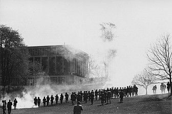 National Guard personnel walking toward crowd near Taylor Hall, tear gas has been fired<br>Kent State University Libraries. <a href="https://omeka.library.kent.edu/special-collections/items/show/1429" target="_blank">Special Collections and Archives</a>
