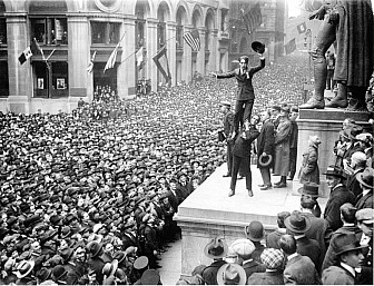 Charlie Chaplin stands on Douglas Fairbanks' shoulders during a rally at Wall Street in 1918